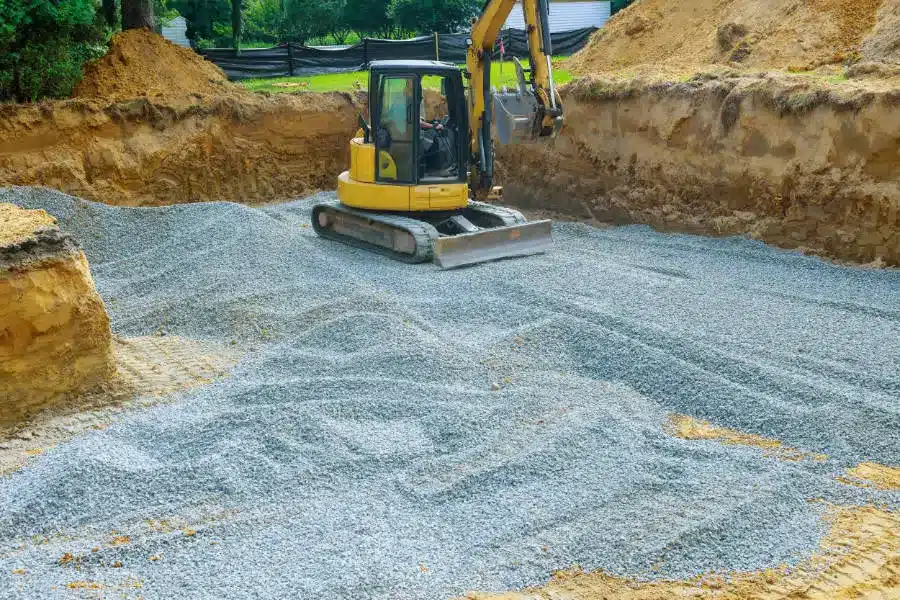 pelleteuse entrain de maneouvreur dans le cadre de travaux d'assainissement dans les Yvelines